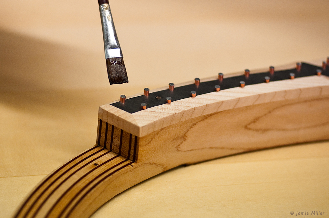 Applying Sealer to a Bass Bridge